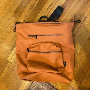 OneDuo waxed canvas diaper bag in orange